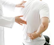 Man experiencing back pain