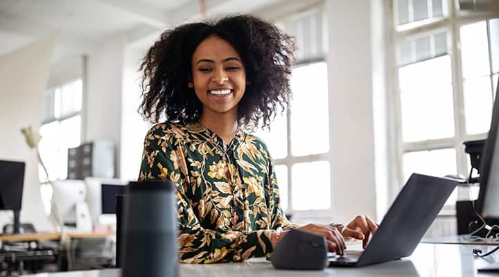 Woman working on laptop with magnesium supported brain health